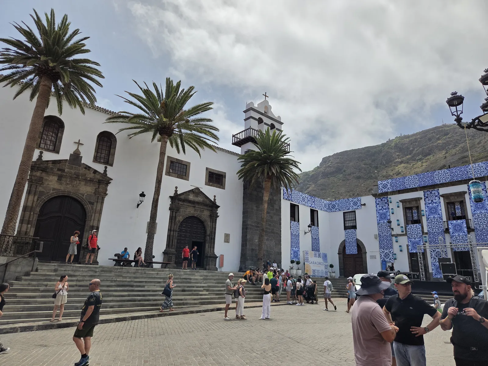 Church of Santa Ana beside palm trees, broad steps and historic buildings in Garachico