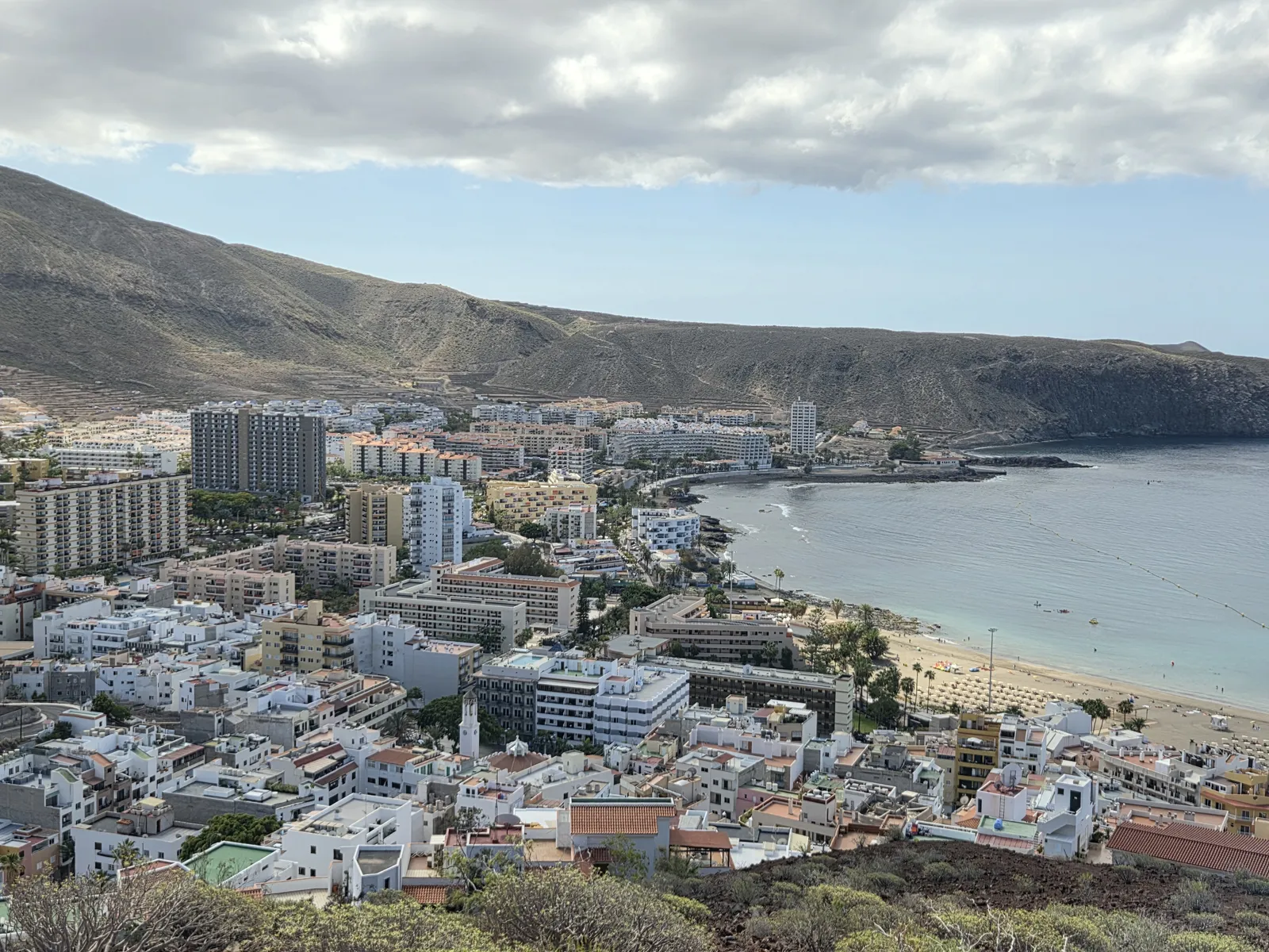 Los Cristianos town and sandy bay beneath the volcanic slopes of Montaña de Guaza