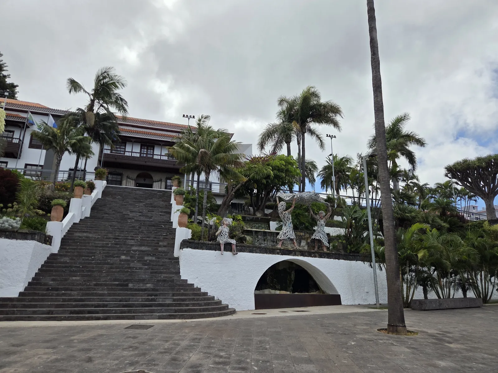 Broad stone staircase beside palms and terraced gardens below El Sauzal town hall